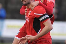 Alex Markham jumping on James Williamson after his goal for Bridlington Town in Saturday's 3-0 home win against Consett. PHOTO BY DOM TAYLOR