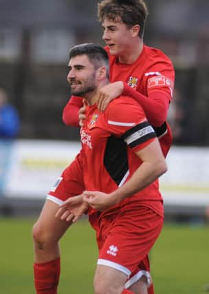 Alex Markham jumping on James Williamson after his goal for Bridlington Town in Saturday's 3-0 home win against Consett. PHOTO BY DOM TAYLOR