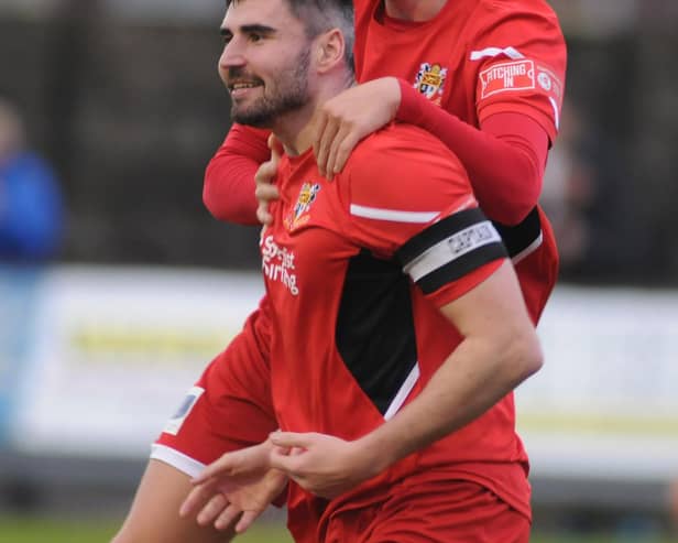 Alex Markham jumping on James Williamson after his goal for Bridlington Town in Saturday's 3-0 home win against Consett. PHOTO BY DOM TAYLOR