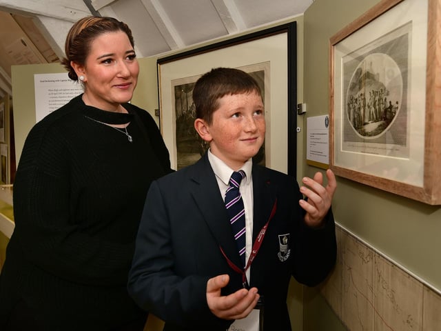 Visitor Aisha Kennedy being shown the exhibits by an Eskdale School student.
picture: Richard Ponter