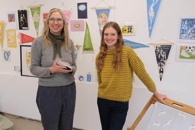 Poet Charlotte Oliver and, right, artist Hannah Grahamslaw in the Glass Box (credt Richard Ponter)