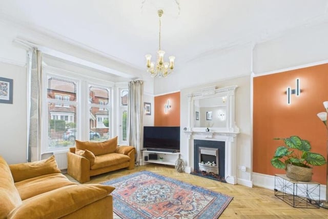 A bright and elegant, bay fronted reception room.
