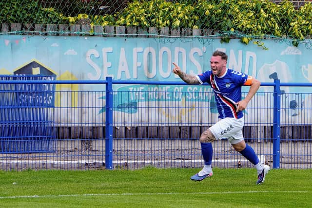 Whitby captain Stuart Rose races away to celebrate scoring his side's second goal to make it 2-0 at half-time. Photo by Owen Cox