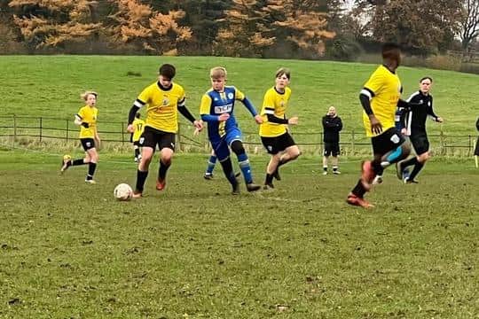 Jayden Wood on the ball for the hosts Scalby U14s.