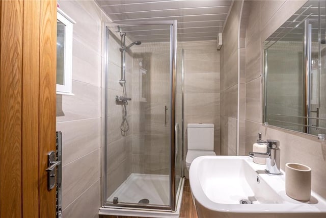 A fully tiled shower room.
