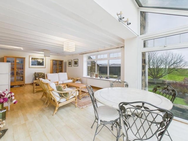 Bright, spacious rooms have picture windows revealing far reaching views.