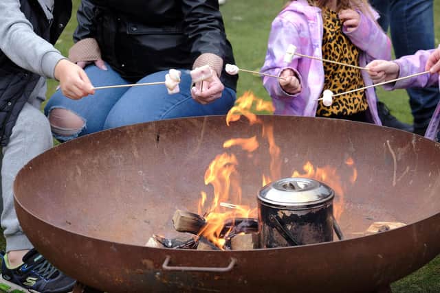 Toasting marshmallows round the fire pit