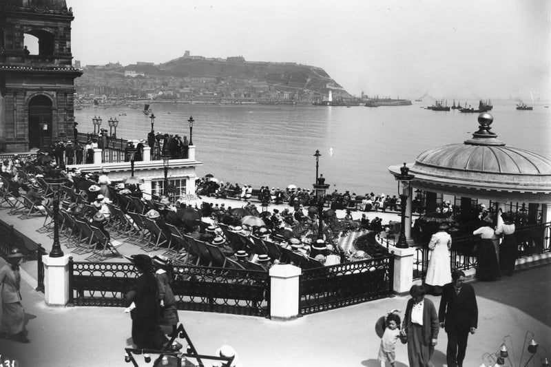 circa 1913:  Holiday crowds listen to the band playing in the bandstand at the Spa, Scarborough.  (Photo by Hulton Archive/Getty Images)
