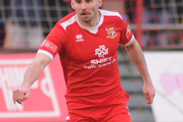 James Williamson in action against Lincoln United.