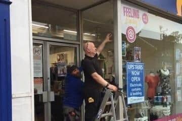 Scarborough’s SWC Trade Frames has replaced the smashed window at Saint Catherine’s Hospice’s charity shop free of charge.