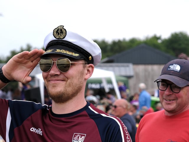 Saluting the racing teams.