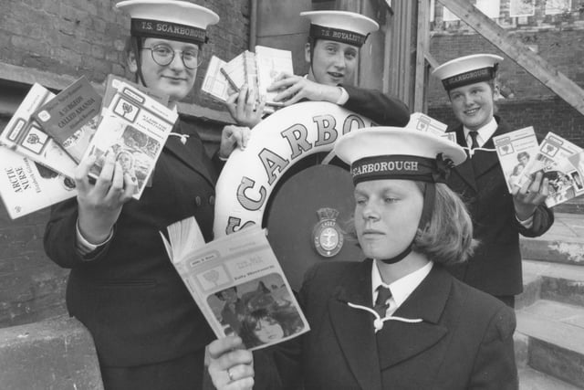 Pictured getting ready for their book sale are TS Unseen Sea Cadets, from left, Megan Peters, Zoe Roberts, Natalie Cooper, and Susan Simpson, front. Photo taken in July 1994. 