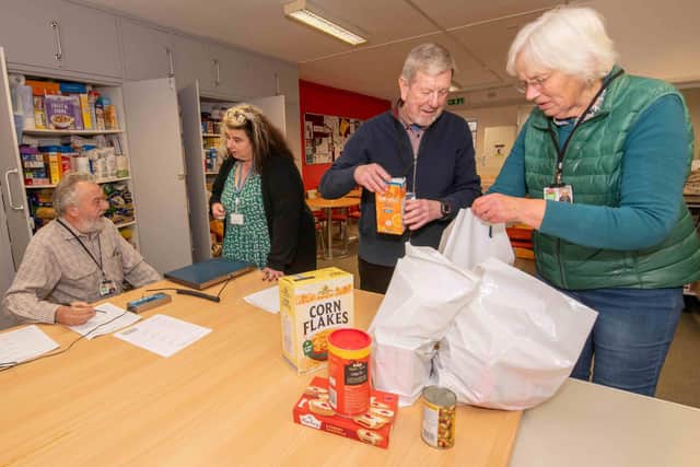 North Yorkshire Council’s member for the Pickering division, Cllr Joy Andrews, chats to volunteers to learn how donated food items are distributed to struggling members of the community.