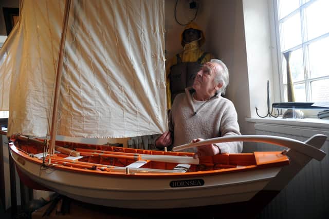 Joe Gelsthorpe with his quarter-scale model of the former East Coast fishing coble Psamathe.