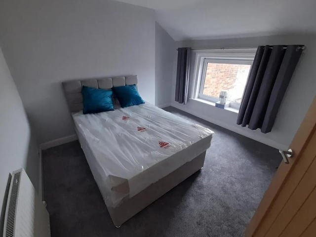 The second double bedroom to the rear of the building has views out toward Scarborough Castle.
