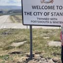 Whitby Town Mayor, Cllr Linda Wild, with her copy of the Whitby Gazette at the City of Stanley, Falkland Islands.