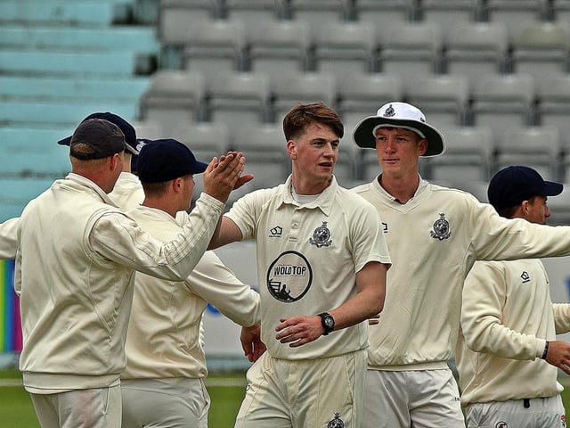 Scarborough CC players congratulate Corey Hart on his first wicket