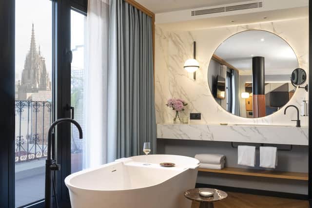 Kimpton Vividora rooms' contemporary comfort complements antiquated architecture outside.