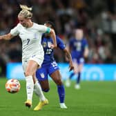 Beth Mead of England runs with the ball while under pressure from Crystal Dunn of United States (Photo by David Rogers/Getty Images)