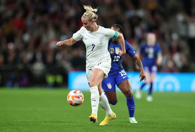 Beth Mead of England runs with the ball while under pressure from Crystal Dunn of United States (Photo by David Rogers/Getty Images)