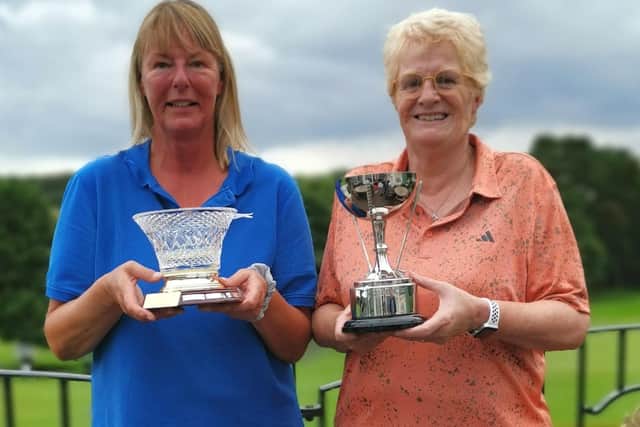Melanie Morton, left, and Ali Lockwood earned the trophies.