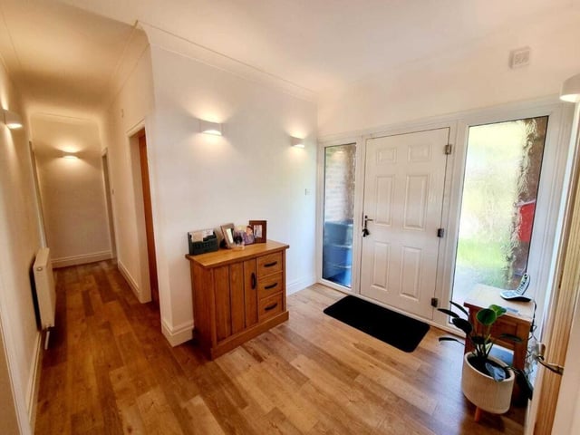A bright and spacious hallway leads in to the home.