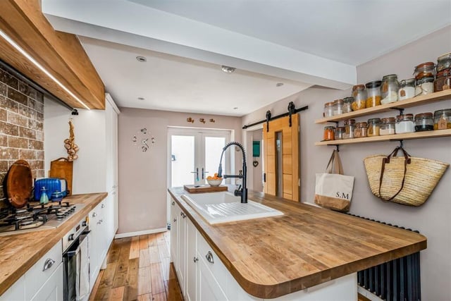 The modern kitchen has a large island unit.