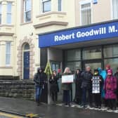 Protestors gather outside Sir Robert Goodwill's constituency office in Scarborough.