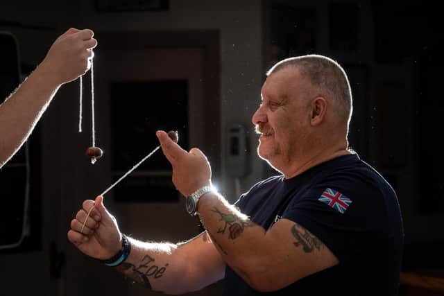 Stuart Ward tries his hand before refereeing the Bourne Arms Knott End and Preesall World Conkers Championship
