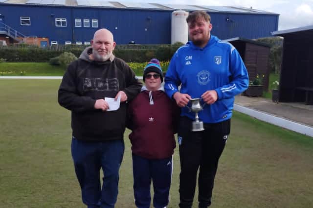 Kevin Gates, left, and Callum Malone earned victory at the Hunmanby Drawn Pairs Merit, Lisa Watson, centre, presenting the prizes.