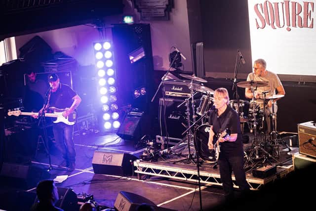 Squire live on stage.