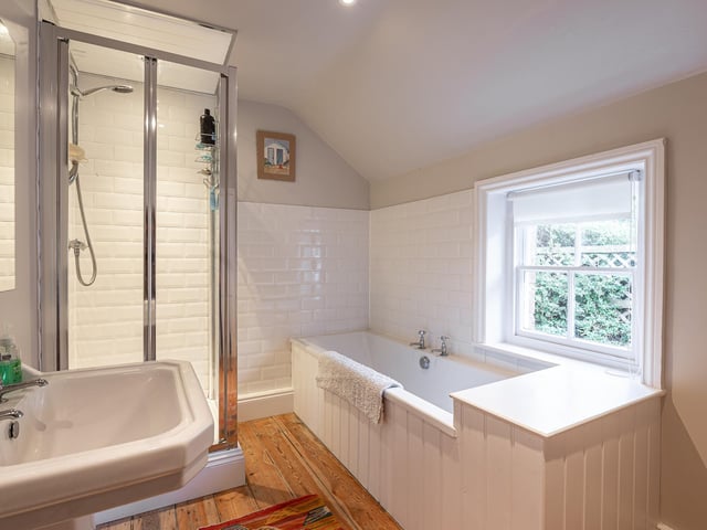 Both a bath and a shower cubicle form part of the bathroom suite on the first floor.
