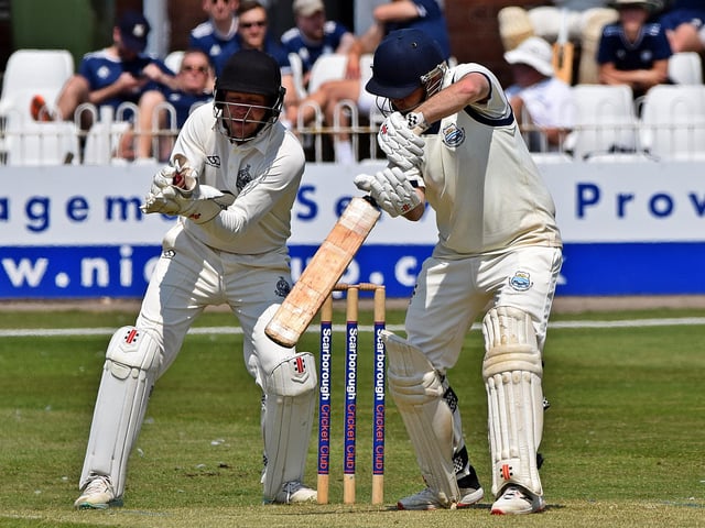 Beverley opener Tom Norman plays and misses.