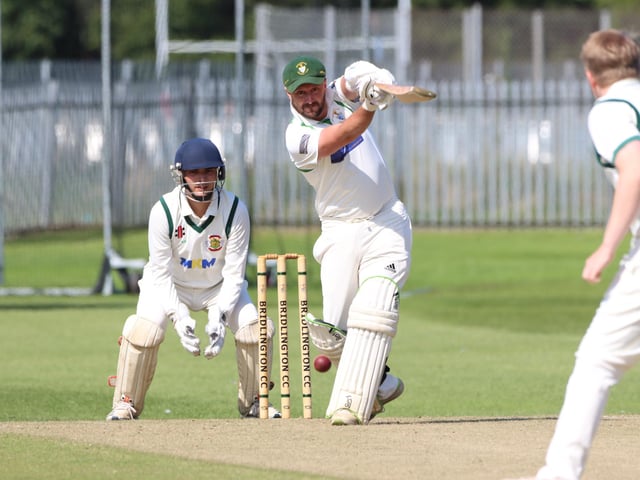 A home batter plays a drive