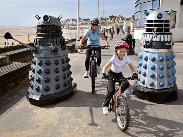 Bridlington Comic Con, cycling past the Daleks on the Promenade.