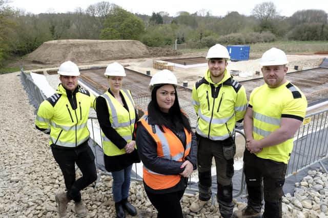 Charity CEO Gemma Lowery, centre, COO Lynn Murphy, left, and the construction team.