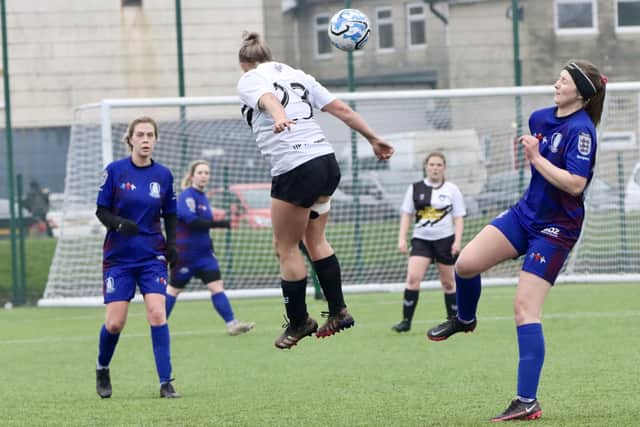 Leven Ladies, white shirt, leap to win a header at Brid. PHOTOS: TCF PHOTOGRAPHY