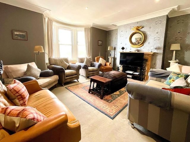 A spacious, bay-fronted lounge within the property.