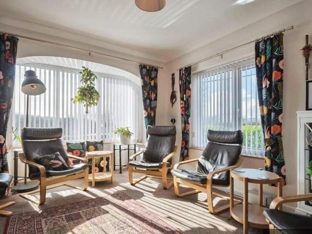 A lovely double aspect room within the house.