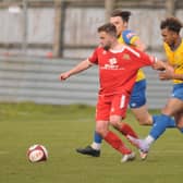 A Stocksbridge Park Steels player gets to grips with Bridlington Town's Andy Norfolk in the 1-0 win for the Seasiders. PHOTOS BY DOM TAYLOR