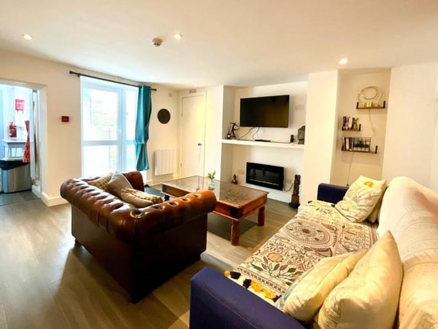 A lower level sitting room again has plenty of natural light.