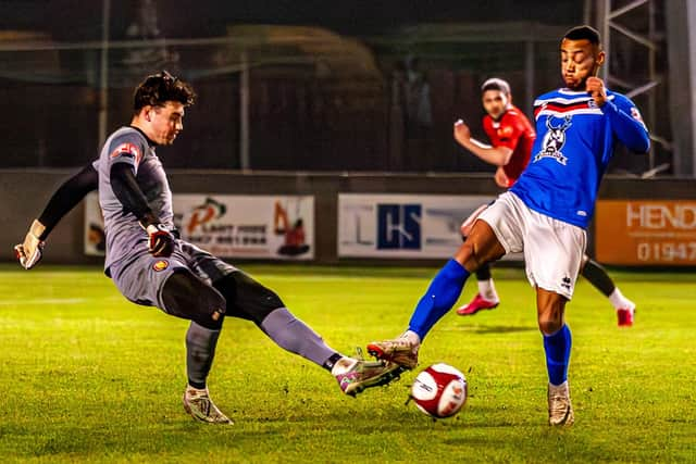 Blues attacker Junior Mondal tries to close down the FCUM goalkeeper. PHOTOS: BRIAN MURFIELD