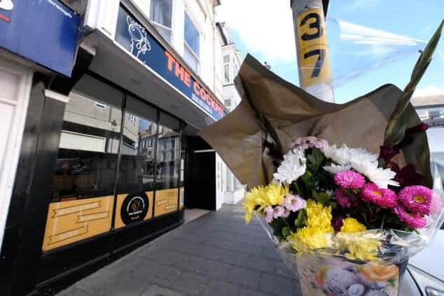 Floral tributes were left at the scene of the fatal incident outside The Cockpit restaurant on Newborough.