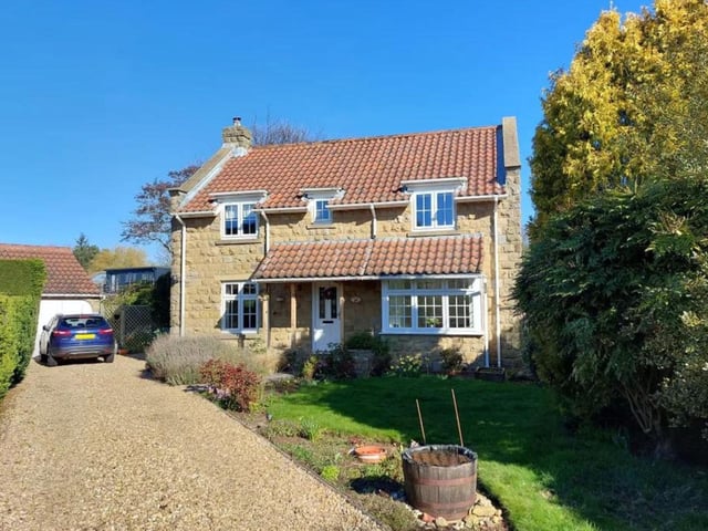 This four bedroom and two bathroom detached home on Bridge Close in Burniston is currently for sale with Colin Ellis for £425,000.