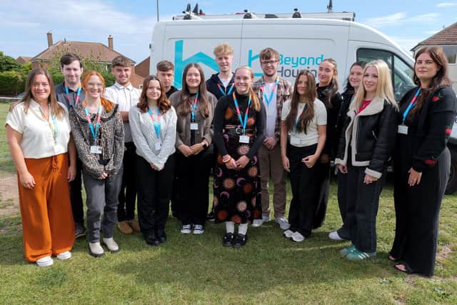 Beyond Housing's 2025 cadre of apprentices pictured with apprentice and volunteer team leader Maria Taylor (left) and apprenticeship co-ordinator Sophie Bain (right).