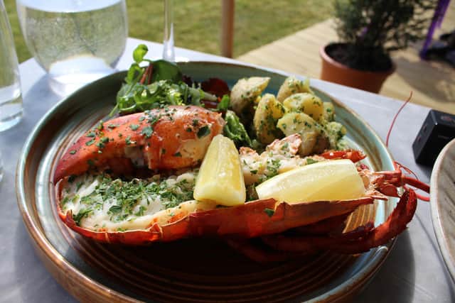 The sweet meaty flesh of half a lobster