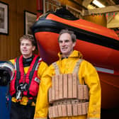 Alex Harrison-Gaze (left) and his father Colin Harrison. Alex is wearing the current ILB gear while Colin is wearing the cork life jacket introduced in 1854.