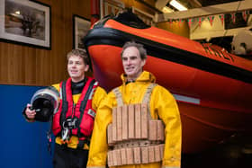 Alex Harrison-Gaze (left) and his father Colin Harrison. Alex is wearing the current ILB gear while Colin is wearing the cork life jacket introduced in 1854.