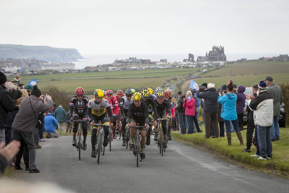 Cyclists make their way through the outskirts of Whitby during the Tour de Yorkshire