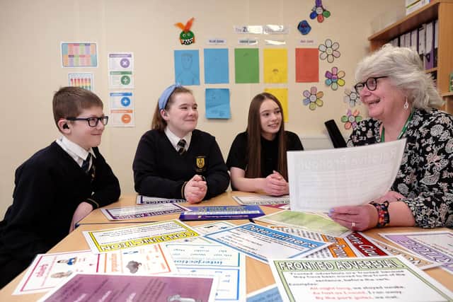 Judith McCulloch working with hearing impaired students at St Augustine's